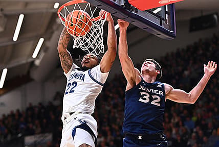 Jan 7, 2023; Villanova, Pennsylvania, USA; Villanova Wildcats forward Cam Whitmore (22) dunks over Xavier Musketeers forward Zach Freemantle (32) in the first half at William B. Finneran Pavilion. Mandatory Credit: Kyle Ross-USA TODAY Sports