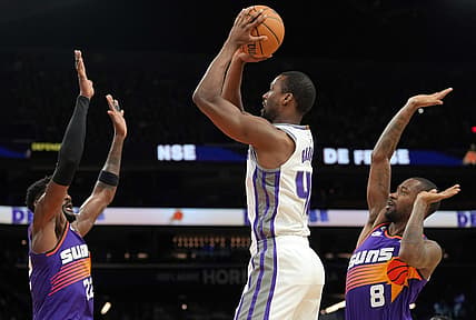 Mar 11, 2023; Phoenix, Arizona, USA; Sacramento Kings forward Harrison Barnes (40) shoots over Phoenix Suns center Deandre Ayton (22) and Phoenix Suns guard Terrence Ross (8) during the first half at Footprint Center. Mandatory Credit: Joe Camporeale-USA TODAY Sports