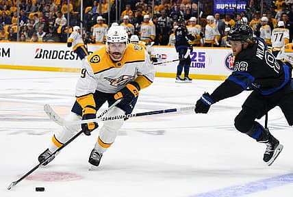 Oct 28, 2023; Nashville, Tennessee, USA; Nashville Predators left wing Filip Forsberg (9) skates the puck into the offensive zone against Toronto Maple Leafs right wing William Nylander (88) during the first period at Bridgestone Arena. Mandatory Credit: Christopher Hanewinckel-USA TODAY Sports