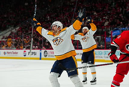 Dec 15, 2023; Raleigh, North Carolina, USA;  Nashville Predators left wing Filip Forsberg (9) celebrates his game winning goal in the overtime against the Carolina Hurricanes at PNC Arena. Mandatory Credit: James Guillory-USA TODAY Sports