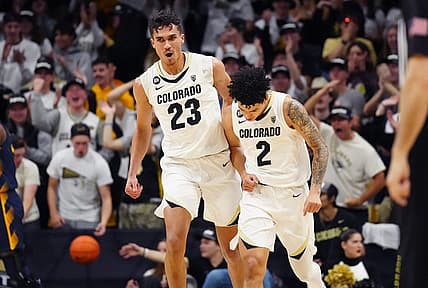 Feb 28, 2024; Boulder, Colorado, USA; Colorado Buffaloes forward Tristan da Silva (23) celebrates with guard KJ Simpson (2) in the first half against the California Golden Bears at the CU Events Center. Mandatory Credit: Ron Chenoy-USA TODAY Sports