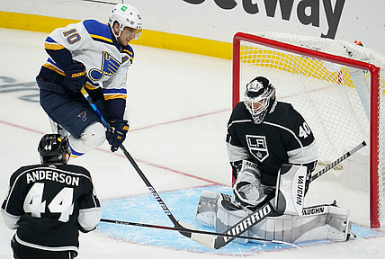 Mar 5, 2021; Los Angeles, California, USA; Los Angeles Kings goaltender Calvin Petersen (40) makes a save as St. Louis Blues center Brayden Schenn (10) jumps out of the way during the third period at Staples Center. Mandatory Credit: Robert Hanashiro-USA TODAY Sports