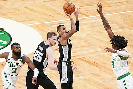 Apr 30, 2021; Boston, Massachusetts, USA; San Antonio Spurs guard Dejounte Murray (5) shoots against Boston Celtics center Robert Williams III (44) in the third quarter at TD Garden. Mandatory Credit: David Butler II-USA TODAY Sports