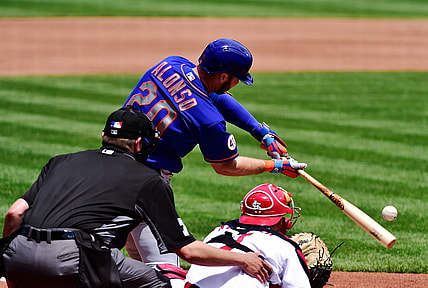 May 6, 2021; St. Louis, Missouri, USA;  New York Mets first baseman Pete Alonso (20) hits a single during the third inning against the St. Louis Cardinals at Busch Stadium. Mandatory Credit: Jeff Curry-USA TODAY Sports