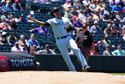 Jun 3, 2021; Denver, Colorado, USA; Colorado Rockies third baseman Joshua Fuentes (8) fields the ball in the second inning against the Texas Rangers at Coors Field. Mandatory Credit: Ron Chenoy-USA TODAY Sports