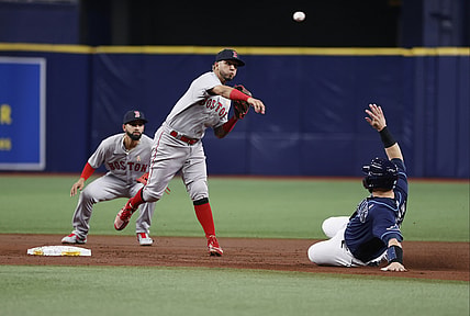 Sep 1, 2021; St. Petersburg, Florida, USA;  Boston Red Sox shortstop Jonathan Arauz (3) forces out Tampa Bay Rays catcher Mike Zunino (10) and throws the ball to first base for a double play during the second inning at Tropicana Field. Mandatory Credit: Kim Klement-USA TODAY Sports