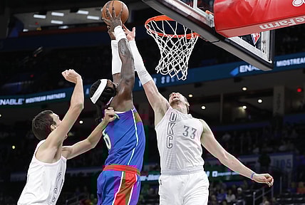 Nov 26, 2021; Oklahoma City, Oklahoma, USA; Oklahoma City Thunder center Mike Muscala (33) blocks a shot by Washington Wizards center Montrezl Harrell (6) during the second quarter at Paycom Center. Mandatory Credit: Alonzo Adams-USA TODAY Sports