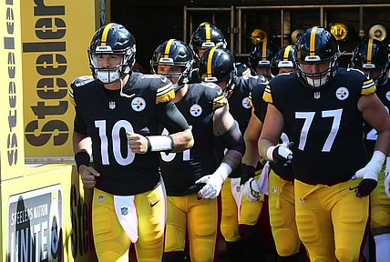 Aug 28, 2022; Pittsburgh, Pennsylvania, USA;  Pittsburgh Steelers quarterback Mitch Trubisky (10) leads the team out onto the field to warm up against the Detroit Lions at Acrisure Stadium. Mandatory Credit: Charles LeClaire-USA TODAY Sports