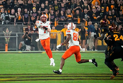Sep 9, 2023; Tempe, Arizona, USA; Oklahoma State Cowboys quarterback Alan Bowman (7) throws a to wide receiver Brennan Presley (80) against the Arizona State Sun Devils in the first half at Mountain America Stadium. Mandatory Credit: Rob Schumacher-Arizona Republic