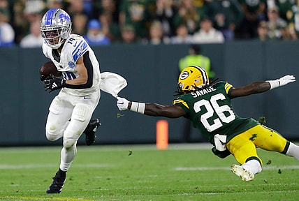 Detroit Lions wide receiver Amon-Ra St. Brown (14) gets past a tackle attempt by Green Bay Packers safety Darnell Savage (26) during their football game Thursday, September 28, 2023, at Lambeau Field in Green Bay, Wis. 
Dan Powers/USA TODAY NETWORK-Wisconsin.