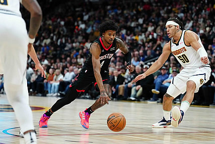 Dec 8, 2023; Denver, Colorado, USA; Houston Rockets guard Jalen Green (4) drives at Denver Nuggets forward Aaron Gordon (50) in the first quarter at Ball Arena. Mandatory Credit: Ron Chenoy-USA TODAY Sports
