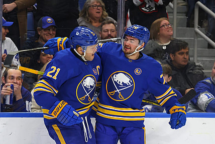 Dec 21, 2023; Buffalo, New York, USA;  Buffalo Sabres right wing Kyle Okposo (21) celebrates his shorthanded goal with defenseman Connor Clifton (75) during the second period against the Toronto Maple Leafs at KeyBank Center. Mandatory Credit: Timothy T. Ludwig-USA TODAY Sports