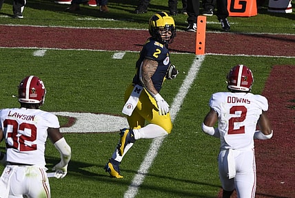 Jan 1, 2024; Pasadena, CA, USA; Michigan Wolverines running back Blake Corum (2) scores a touchdown past Alabama Crimson Tide linebacker Deontae Lawson (32) and defensive back Caleb Downs (2) in the 2nd quarter of the 2024 Rose Bowl college football playoff semifinal game at Rose Bowl. Mandatory Credit: Robert Hanashiro-USA TODAY Sports