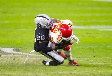 Nov 22, 2020; Paradise, Nevada, USA; Las Vegas Raiders cornerback Nevin Lawson (26) tackles Kansas City Chiefs wide receiver Mecole Hardman (17) at Allegiant Stadium. Mandatory Credit: Mark J. Rebilas-USA TODAY Sports