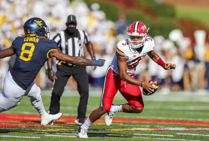 Sep 4, 2021; College Park, Maryland, USA; Maryland Terrapins quarterback Taulia Tagovailoa (3) escapes the pocket and pressure from West Virginia Mountaineers linebacker VanDarius Cowan (8) during the second quarter at Capital One Field at Maryland Stadium. Mandatory Credit: Ben Queen-USA TODAY Sports
