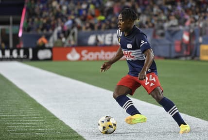 Sep 25, 2021; Foxborough, Massachusetts, USA; New England Revolution forward DeJuan Jones (24) controls the ball against Orlando City during the second half at Gillette Stadium. Mandatory Credit: Bob DeChiara-USA TODAY Sports