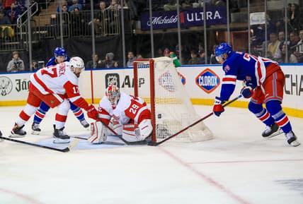 Feb 17, 2022; New York, New York, USA; New York Rangers defenseman K'Andre Miller (79) scores a wrap-around goal on Detroit Red Wings defenseman Gustav Lindstrom (28) during the second period at Madison Square Garden. Mandatory Credit: Danny Wild-USA TODAY Sports