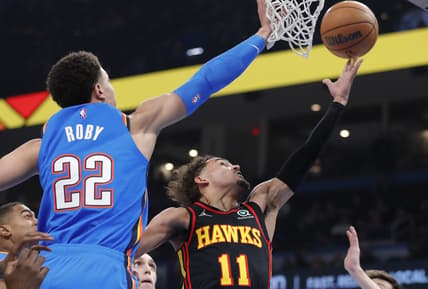 Mar 30, 2022; Oklahoma City, Oklahoma, USA; Atlanta Hawks guard Trae Young (11) goes to the basket as Oklahoma City Thunder forward Isaiah Roby (22) defends during the first quarter at Paycom Center. Mandatory Credit: Alonzo Adams-USA TODAY Sports