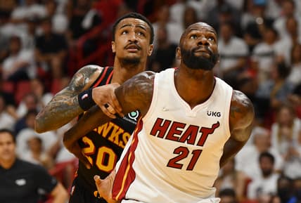 Apr 17, 2022; Miami, Florida, USA; Miami Heat center Dewayne Dedmon (21) and Atlanta Hawks forward John Collins (20) battle for rebounding position during the second half of game one of the first round for the 2022 NBA playoffs at FTX Arena. Mandatory Credit: Jim Rassol-USA TODAY Sports