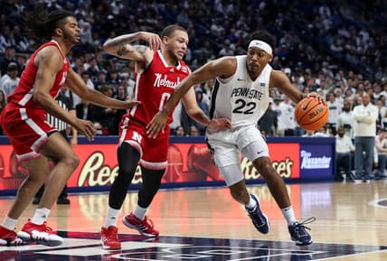 Jan 21, 2023; University Park, Pennsylvania, USA; Penn State Nittany Lions guard Jalen Pickett (22) dribbles the ball around Nebraska Cornhuskers guard CJ Wilcher (0) during the first half at Bryce Jordan Center. Mandatory Credit: Matthew OHaren-USA TODAY Sports