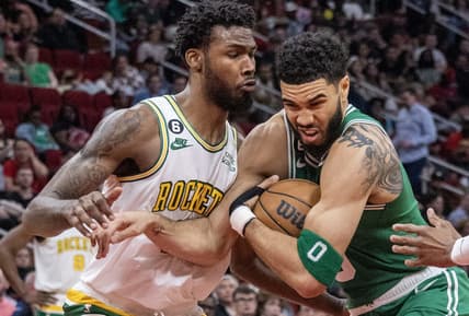 Mar 13, 2023; Houston, Texas, USA; Boston Celtics forward Jayson Tatum (0) moves to the net against Houston Rockets forward Tari Eason (17) in the third quarter at Toyota Center. Mandatory Credit: Thomas Shea-USA TODAY Sports