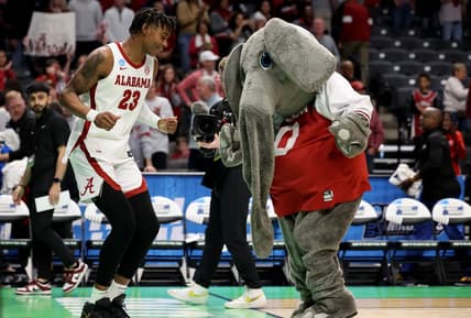 Mar 18, 2023; Birmingham, AL, USA; Alabama Crimson Tide forward Nick Pringle (23) celebrates with the mascot after defeating the Maryland Terrapins at Legacy Arena. Mandatory Credit: Vasha Hunt-USA TODAY Sports