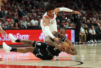 Mar 19, 2023; Portland, Oregon, USA;  Portland Trail Blazers forward Greg Brown III (4) defends LA Clippers forward Kawhi Leonard (2) in the first half at Moda Center. Mandatory Credit: Jaime Valdez-USA TODAY Sports