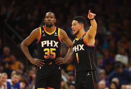 Apr 18, 2023; Phoenix, Arizona, USA; Phoenix Suns guard Devin Booker (1) with forward Kevin Durant (35) against the Los Angeles Clippers in the second half during game two of the 2023 NBA playoffs at Footprint Center. Mandatory Credit: Mark J. Rebilas-USA TODAY Sports