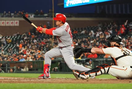 Apr 24, 2023; San Francisco, California, USA; St. Louis Cardinals designated hitter Nolan Gorman (16) hits a single ahead of San Francisco Giants catcher Joey Bart (21) during the sixth inning at Oracle Park. Mandatory Credit: Kelley L Cox-USA TODAY Sports
