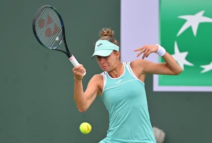 Mar 11, 2023; Indian Wells, CA, USA;  Magda Linette (POL)  hits a shot in her second round match against Emma Raducanu (GBR) in the BNP Paribas Open at the Indian Wells Tennis Garden. Mandatory Credit: Jayne Kamin-Oncea-USA TODAY Sports