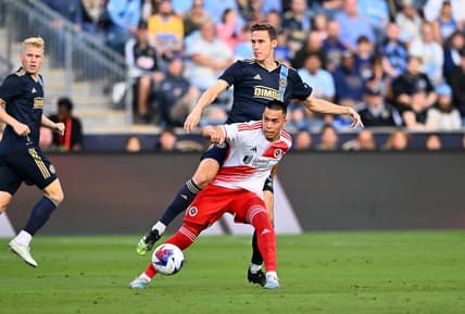 May 20, 2023; Philadelphia, Pennsylvania, USA; Philadelphia Union defender Jack Elliott (3) tackles New England Revolution forward Bobby Wood (17) in the first half at Subaru Park. Mandatory Credit: Kyle Ross-USA TODAY Sports