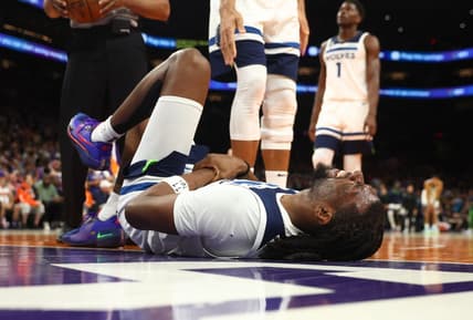 Mar 29, 2023; Phoenix, Arizona, USA; Minnesota Timberwolves center Naz Reid (11) reacts after suffering an injury against the Phoenix Suns in the second half at Footprint Center. Mandatory Credit: Mark J. Rebilas-USA TODAY Sports