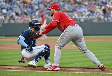 Jun 16, 2023; Kansas City, Missouri, USA; Los Angeles Angels first baseman Jared Walsh (20) tags out Kansas City Royals right fielder MJ Melendez (1) on the first baseline in the third inning at Kauffman Stadium. Mandatory Credit: Peter Aiken-USA TODAY Sports