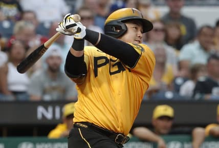 Jul 28, 2023; Pittsburgh, Pennsylvania, USA; Pittsburgh Pirates first baseman Ji Man Choi (91) hits an RBI double against the Philadelphia Phillies during the fourth inning at PNC Park. Mandatory Credit: Charles LeClaire-USA TODAY Sports