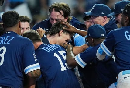 Jul 28, 2023; Kansas City, Missouri, USA; Kansas City Royals shortstop Bobby Witt Jr. (7) celebrates with teammates after hitting a walk-off grand slam against the Minnesota Twins during the tenth inning at Kauffman Stadium. Mandatory Credit: Jay Biggerstaff-USA TODAY Sports