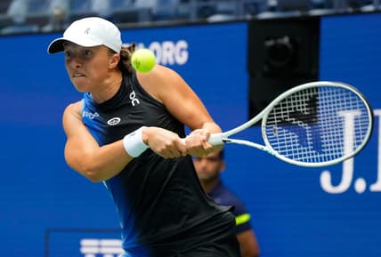 Aug 28, 2023; Flushing, NY, USA; Iga Swiatek of Poland hits to Rebecca Peterson of Sweden on day one of the 2023 U.S. Open tennis tournament at USTA Billie Jean King National Tennis Center. Mandatory Credit: Robert Deutsch-USA TODAY Sports