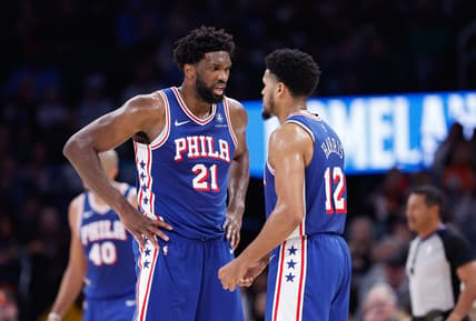 Nov 25, 2023; Oklahoma City, Oklahoma, USA; Philadelphia 76ers center Joel Embiid (21) and forward Tobias Harris (12) talk between plays against the Oklahoma City Thunder during the second half at Paycom Center. Mandatory Credit: Alonzo Adams-USA TODAY Sports
