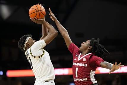Jan 31, 2024; Columbia, Missouri, USA; Missouri Tigers guard Anthony Robinson II (14) shoots against Arkansas Razorbacks guard Keyon Menifield Jr. (1) during the first half at Mizzou Arena. Mandatory Credit: Jay Biggerstaff-USA TODAY Sports