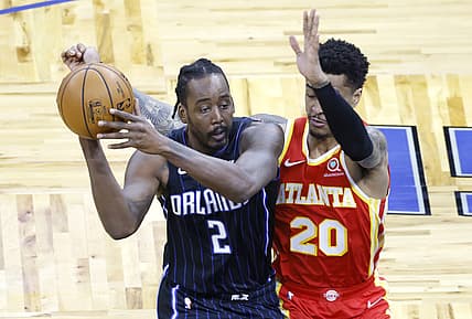 Mar 3, 2021; Orlando, Florida, USA; Atlanta Hawks forward John Collins (20) guards Orlando Magic forward Al-Farouq Aminu (2) during the third quarter at Amway Center. Mandatory Credit: Reinhold Matay-USA TODAY Sports