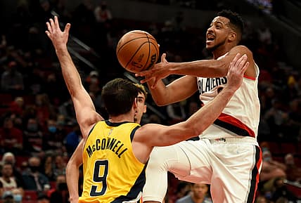 Nov 5, 2021; Portland, Oregon, USA; Portland Trail Blazers guard CJ McCollum (3) drives to the basket on Indiana Pacers guard T.J. McConnell (9) during the first quarter of the game at Moda Center. Mandatory Credit: Steve Dykes-USA TODAY Sports