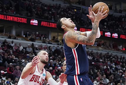 Jan 7, 2022; Chicago, Illinois, USA;Washington Wizards forward Kyle Kuzma (33) is defended by Chicago Bulls guard Zach LaVine (8) during the second half at United Center. Mandatory Credit: David Banks-USA TODAY Sports