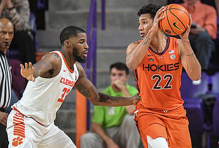 Virginia Tech forward Keve Aluma (22) looks around near Clemson forward Naz Bohannon (33) during the first half at Littlejohn Coliseum Saturday, March 5, 2022.

Ncaa Mbb Virginia Tech At Clemson