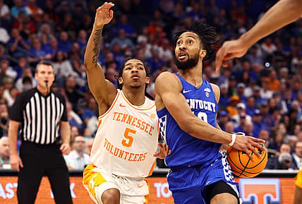 Mar 12, 2022; Tampa, FL, USA; Kentucky Wildcats guard Davion Mintz (10) drives to the basket as Tennessee Volunteers guard Zakai Zeigler (5) defends during the first half at Amalie Arena. Mandatory Credit: Kim Klement-USA TODAY Sports