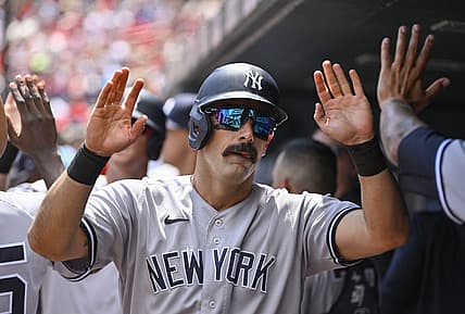 Aug 7, 2022; St. Louis, Missouri, USA;  New York Yankees designated hitter Matt Carpenter (24) is congratulated by teammates after hitting a one run sacrifice fly against the St. Louis Cardinals during the first inning at Busch Stadium. Mandatory Credit: Jeff Curry-USA TODAY Sports