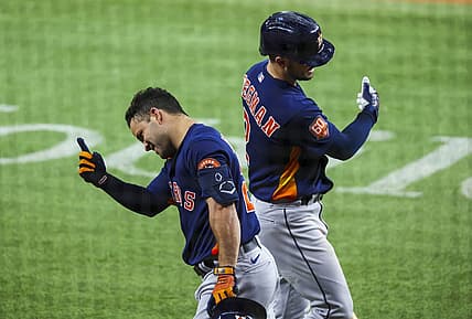 Aug 30, 2022; Arlington, Texas, USA;  Houston Astros second baseman Jose Altuve (27) celebrates with Houston Astros third baseman Alex Bregman (2) after hitting a home run during the third inning against the Texas Rangers at Globe Life Field. Mandatory Credit: Kevin Jairaj-USA TODAY Sports