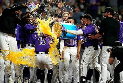 Sep 6, 2022; Denver, Colorado, USA; Colorado Rockies center fielder Randal Grichuk (15) celebrates his walk-off three-run home run in the eleventh inning against the Milwaukee Brewers at Coors Field. Mandatory Credit: Ron Chenoy-USA TODAY Sports