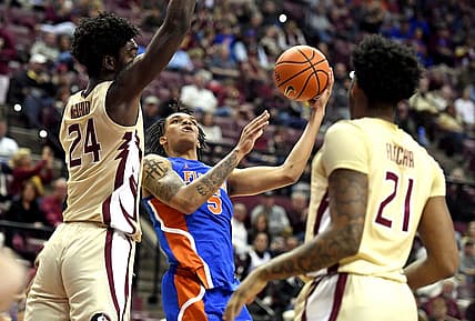 Nov 18, 2022; Tallahassee, Florida, USA; Florida Gators guard Will Richard (5) goes up for a shot past Florida State Seminoles center Naheem McLeod (24) during the first half at Donald L. Tucker Center. Mandatory Credit: Melina Myers-USA TODAY Sports