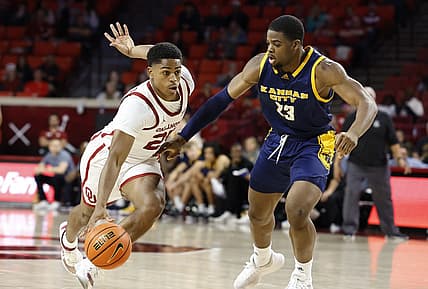 Dec 6, 2022; Norman, Oklahoma, USA; Oklahoma Sooners guard Grant Sherfield (25) drives to the basket against Kansas City Roos forward Allen David Mukeba Jr. (23) during the second half at Lloyd Noble Center. Oklahoma won 75-53. Mandatory Credit: Alonzo Adams-USA TODAY Sports