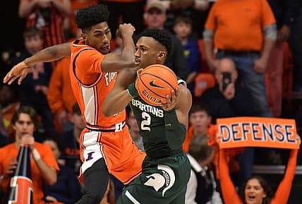 Jan 13, 2023; Champaign, Illinois, USA;  Michigan State Spartans guard Tyson Walker (2) looks to pass as Illinois Fighting Illini guard Sencire Harris (1) defends during the first half at State Farm Center. Mandatory Credit: Ron Johnson-USA TODAY Sports