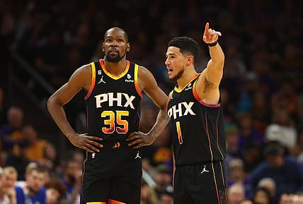 Apr 18, 2023; Phoenix, Arizona, USA; Phoenix Suns guard Devin Booker (1) with forward Kevin Durant (35) against the Los Angeles Clippers in the second half during game two of the 2023 NBA playoffs at Footprint Center. Mandatory Credit: Mark J. Rebilas-USA TODAY Sports